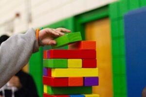A child stacking blocks